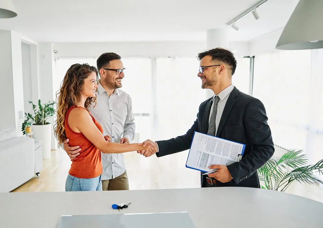 Happy couple finalizing home purchase