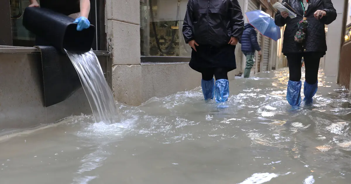 Floodwater covering urban pathway